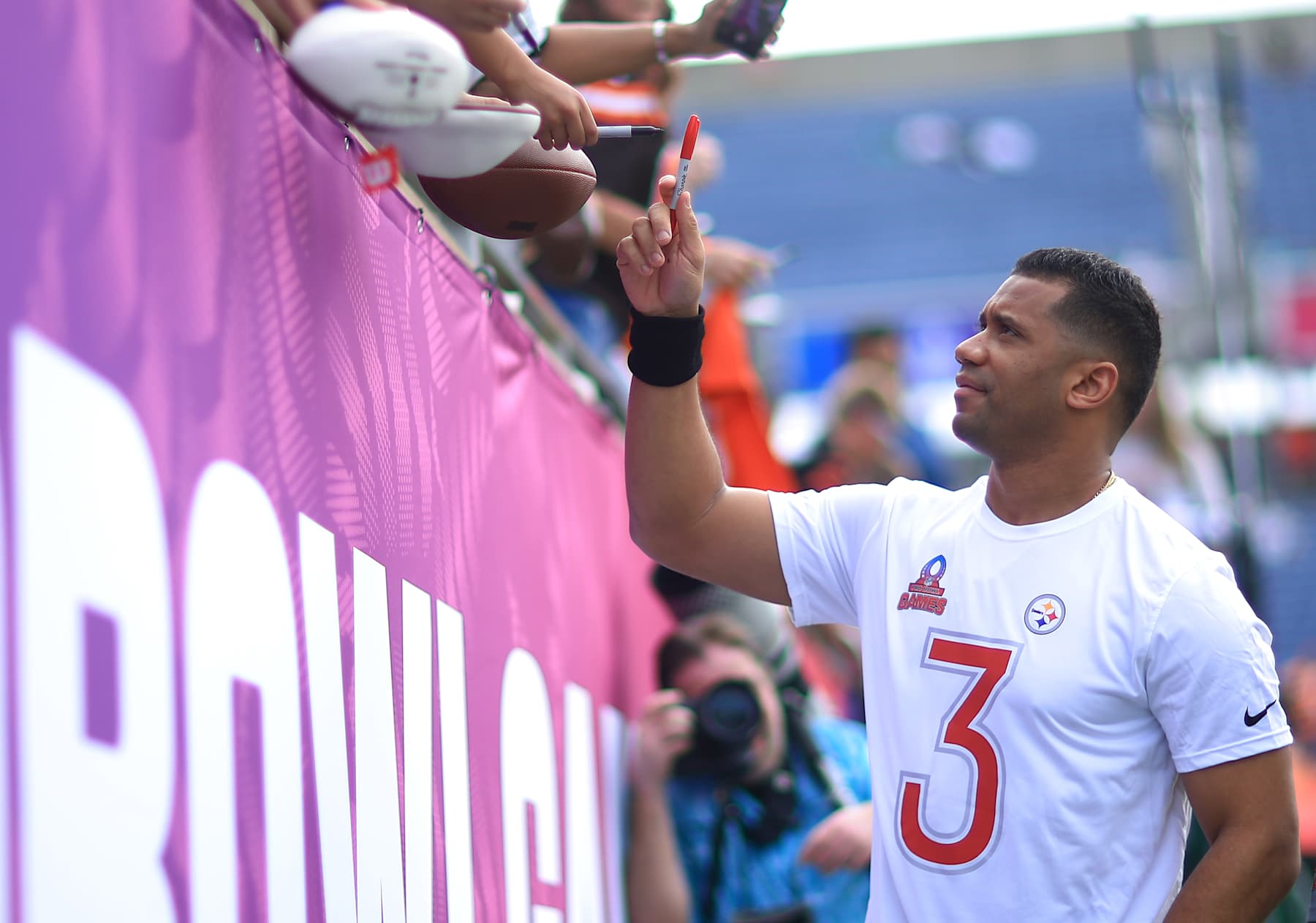 ORLANDO, FLORIDA - FEBRUARY 02: Russell Wilson of the Pittsburgh Steelers signs autographs prior to the NFL Pro Bowl Games at Camping World Stadium on February 02, 2025 in Orlando, Florida. (Photo by Mike Ehrmann/Getty Images)