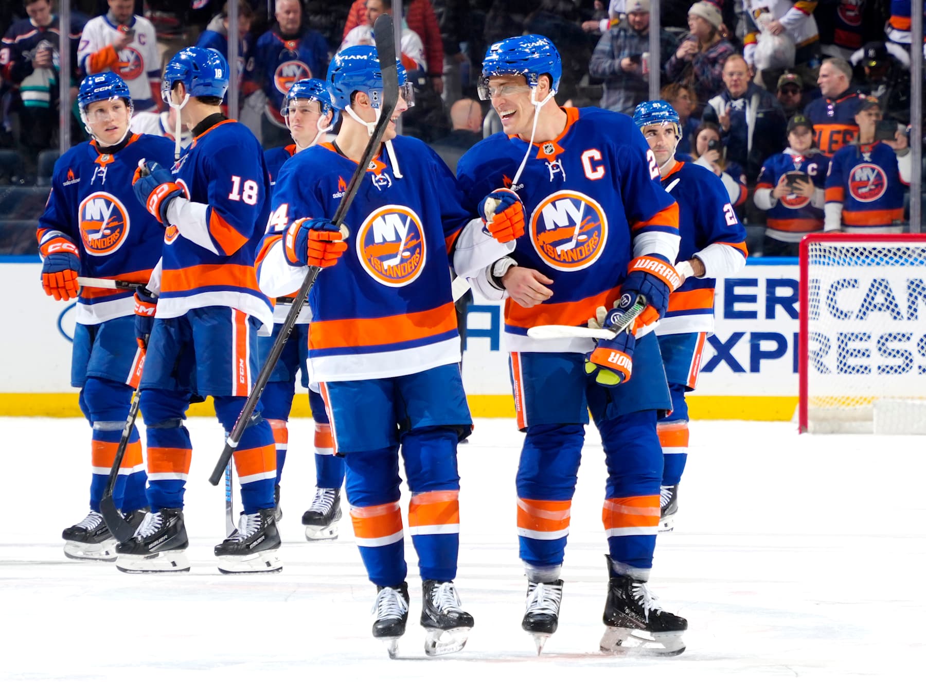 ELMONT, NEW YORK - FEBRUARY 04: Adam Boqvist #34 and Anders Lee #27 of the New York Islanders celebrate the win against the Vegas Golden Knights at UBS Arena on February 04, 2025 in Elmont, New York. (Photo by Mike Stobe/NHLI via Getty Images)