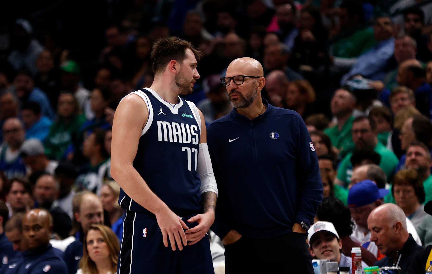 DALLAS, TX - MARCH 17: Luka Doncic #77 of the Dallas Mavericks and head coach Jason Kidd talk on  as the Mavericks take on the Denver Nuggets in the second half at American Airlines Center on March 17, 2024 in Dallas, Texas. NOTE TO USER: User expressly acknowledges and agrees that, by downloading and or using this photograph, User is consenting to the terms and conditions of the Getty Images License Agreement. (Photo by Ron Jenkins/Getty Images)