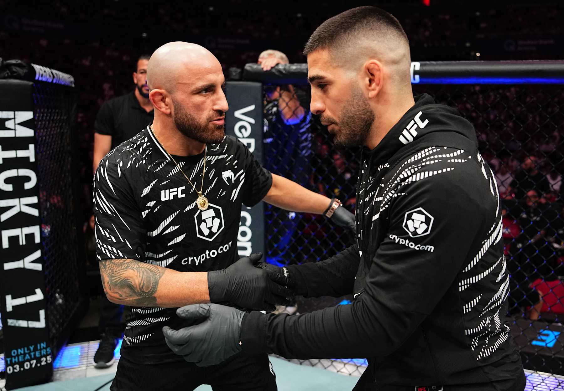 SYDNEY, AUSTRALIA - FEBRUARY 09: (L-R) Former opponents Alexander Volkanovski and Ilia Topuria talk after a bantamweight fight between Aleksandre Topuria and Colby Thicknesse during the UFC 312 event at Qudos Bank Arena on February 09, 2025 in Sydney, Australia. (Photo by Jeff Bottari/Zuffa LLC)