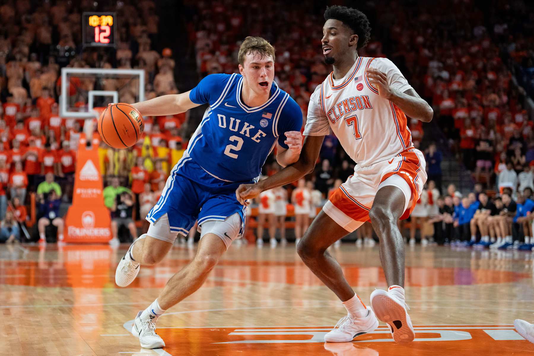 CLEMSON, SOUTH CAROLINA - FEBRUARY 08: Cooper Flagg #2 of the Duke Blue Devils drives to the basket while guarded by Chauncey Wiggins #7 of the Clemson Tigers in the first half during their game at Littlejohn Coliseum on February 08, 2025 in Clemson, South Carolina. (Photo by Jacob Kupferman/Getty Images)