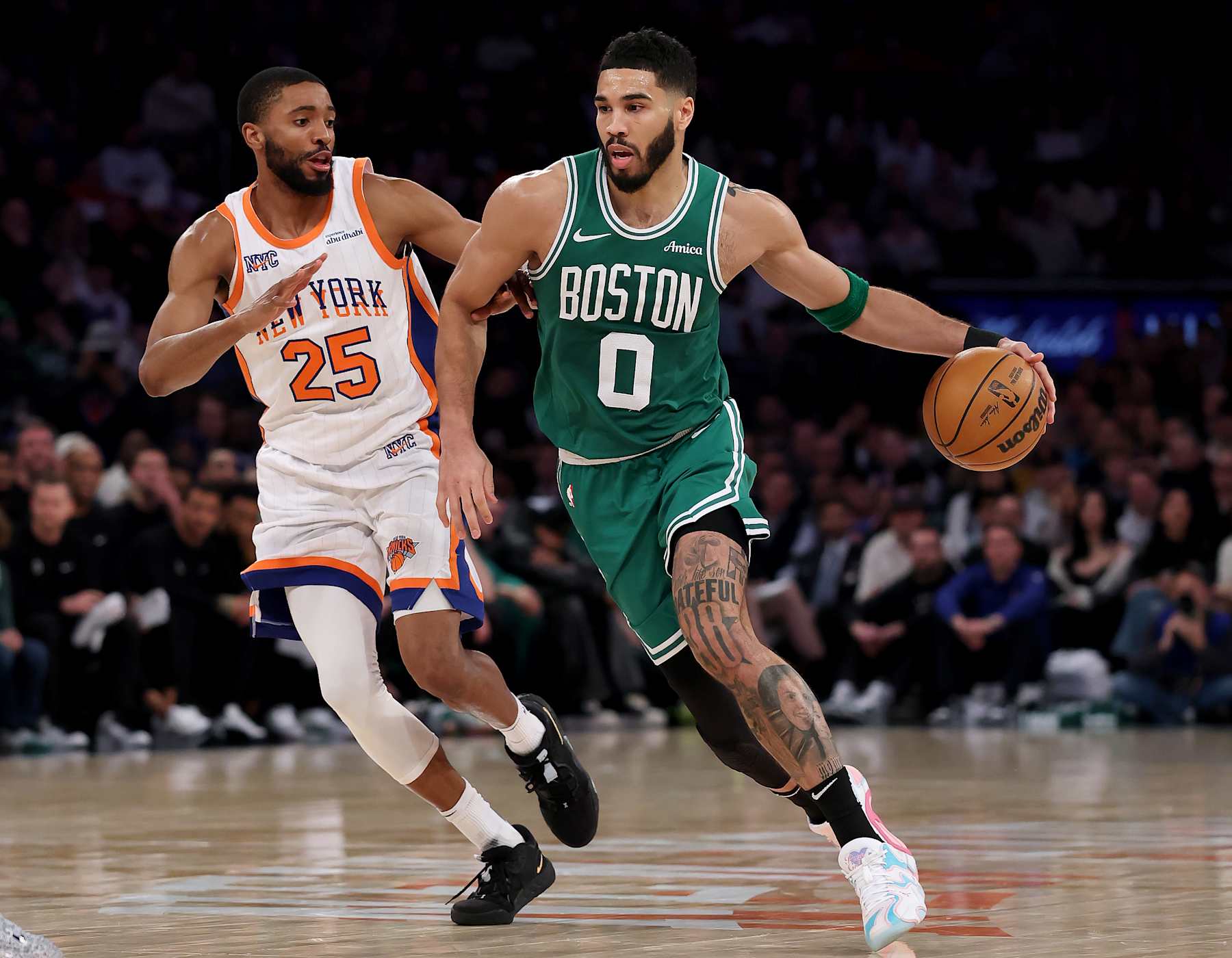 NEW YORK, NEW YORK - FEBRUARY 08:  Jayson Tatum #0 of the Boston Celtics heads for the net as Mikal Bridges #25 of the New York Knicks defends at Madison Square Garden on February 08, 2025 in New York City. NOTE TO USER: User expressly acknowledges and agrees that, by downloading and or using this photograph, User is consenting to the terms and conditions of the Getty Images License Agreement. (Photo by Elsa/Getty Images)