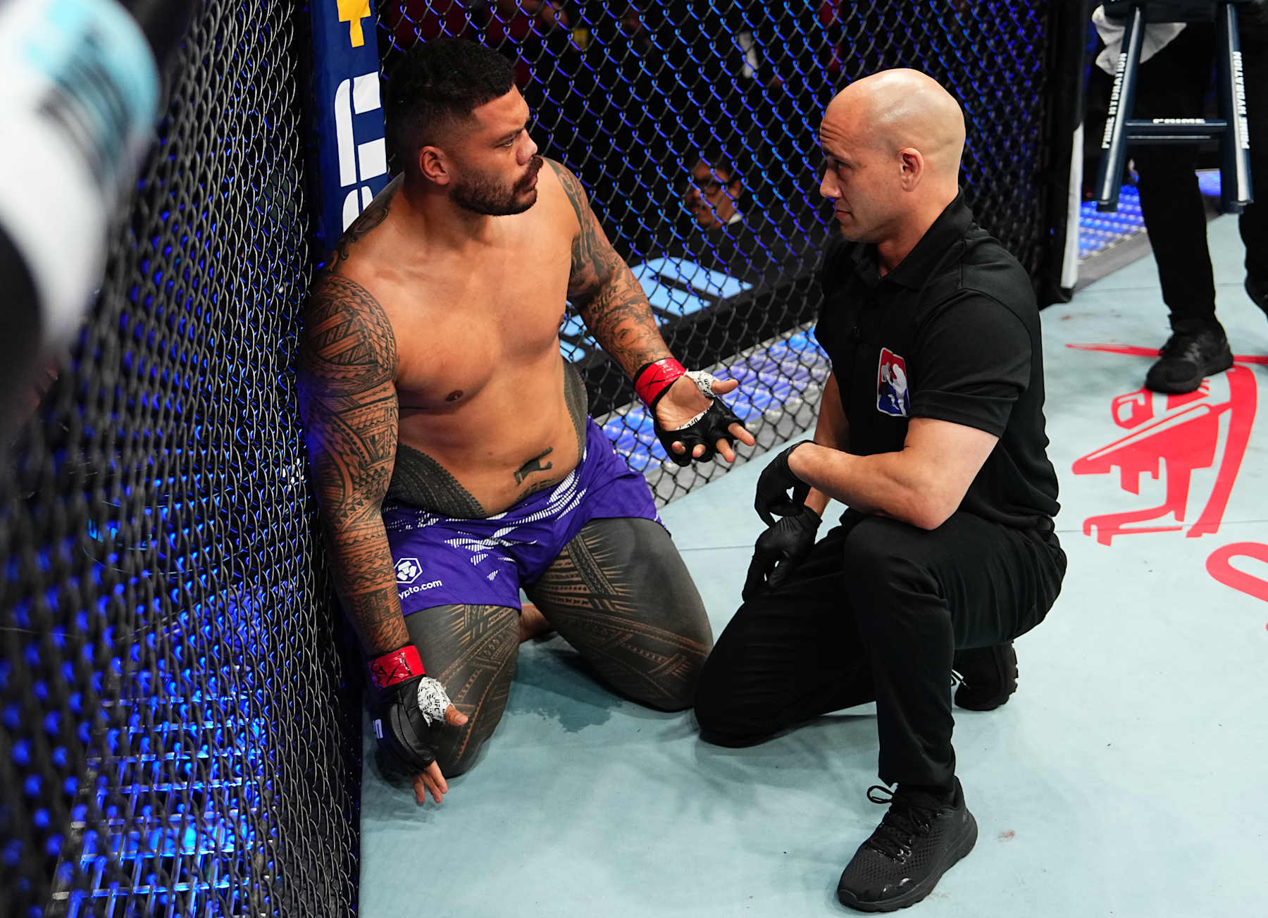 SYDNEY, AUSTRALIA - FEBRUARY 09: Justin Tafa of New Zealand protests after a knockout loss against Tallison Teixeira of Brazil in a heavyweight fight during the UFC 312 event at Qudos Bank Arena on February 09, 2025 in Sydney, Australia. (Photo by Jeff Bottari/Zuffa LLC)
