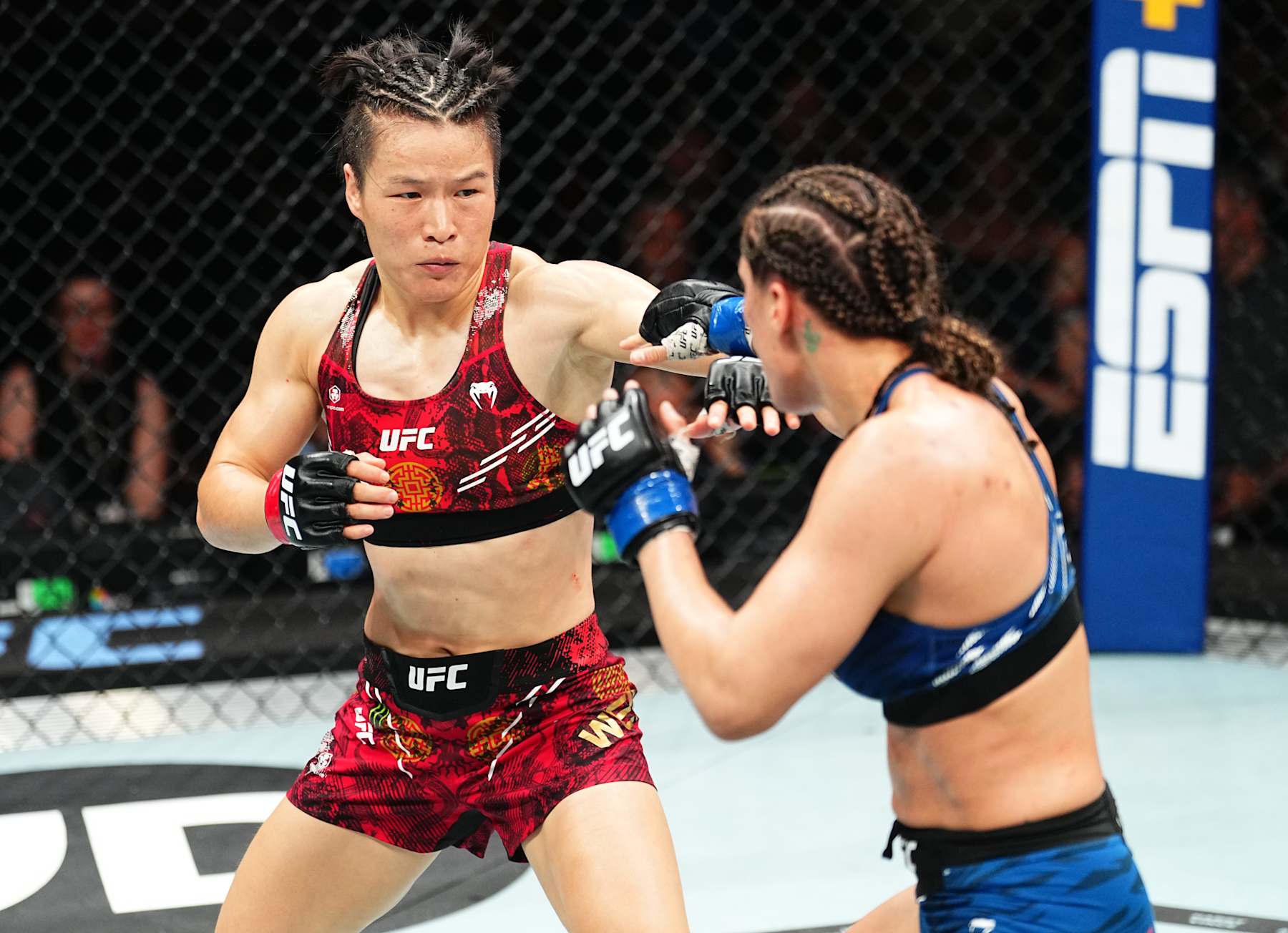 SYDNEY, AUSTRALIA - FEBRUARY 09: (L-R) Zhang Weili of China battles Tatiana Suarez in the UFC strawweight championship fight during the UFC 312 event at Qudos Bank Arena on February 09, 2025 in Sydney, Australia. (Photo by Jeff Bottari/Zuffa LLC)