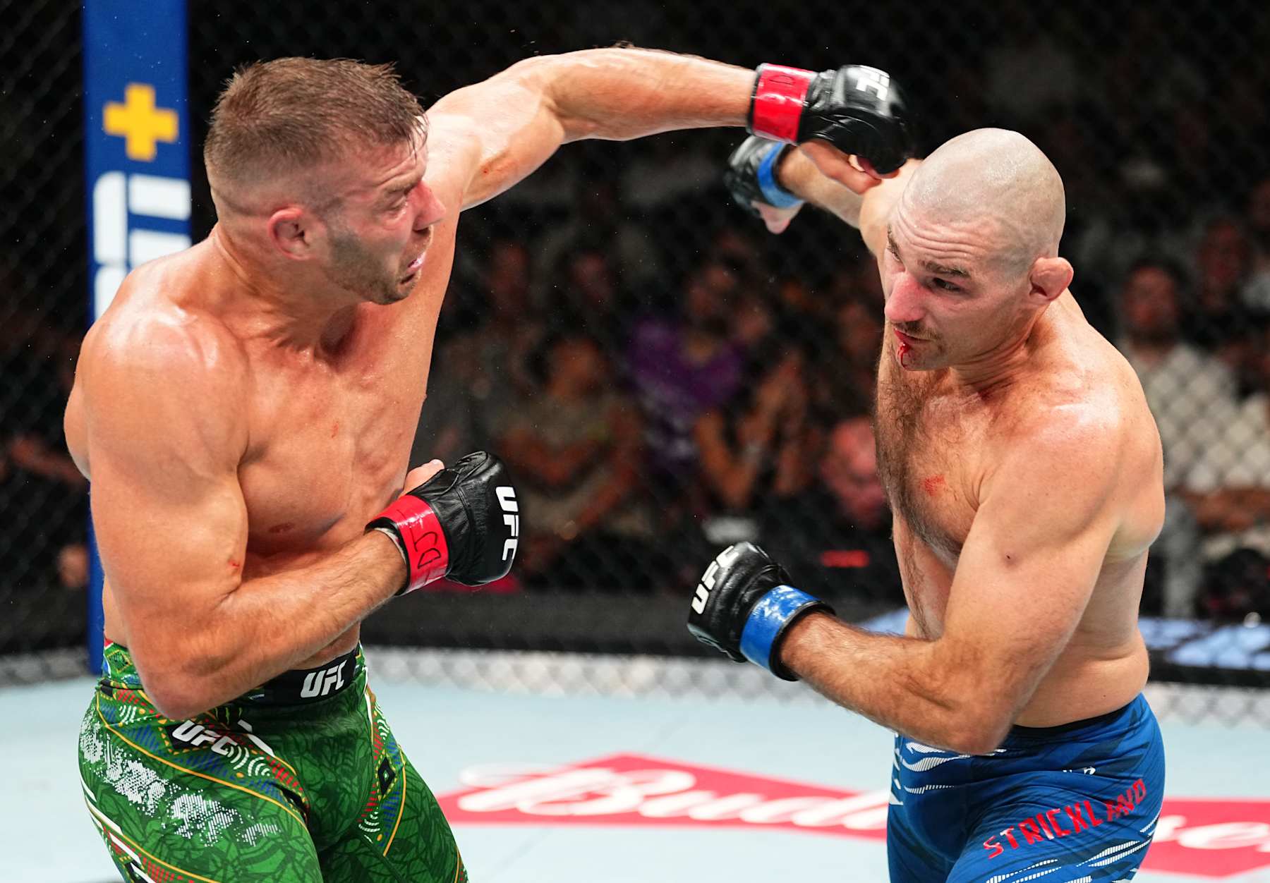 SYDNEY, AUSTRALIA - FEBRUARY 09: (L-R) Dricus Du Plessis of South Africa punches Sean Strickland in the UFC middleweight championship fight during the UFC 312 event at Qudos Bank Arena on February 09, 2025 in Sydney, Australia. (Photo by Jeff Bottari/Zuffa LLC)