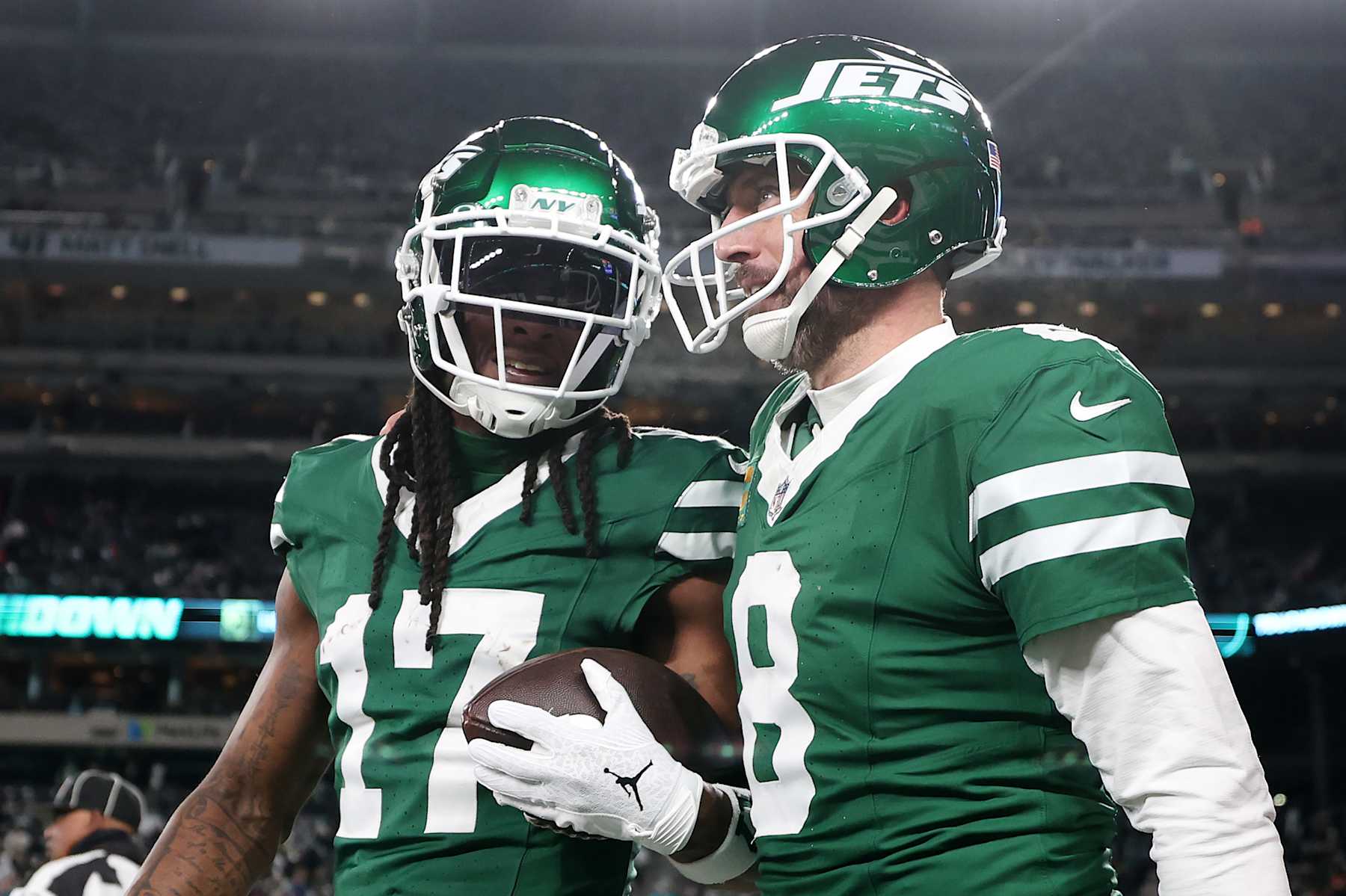EAST RUTHERFORD, NEW JERSEY - JANUARY 05: Davante Adams #17 of the New York Jets celebrates after scoring a touchdown with teammate Aaron Rodgers #8 during the fourth quarter against the Miami Dolphins at MetLife Stadium on January 05, 2025 in East Rutherford, New Jersey. (Photo by Luke Hales/Getty Images)