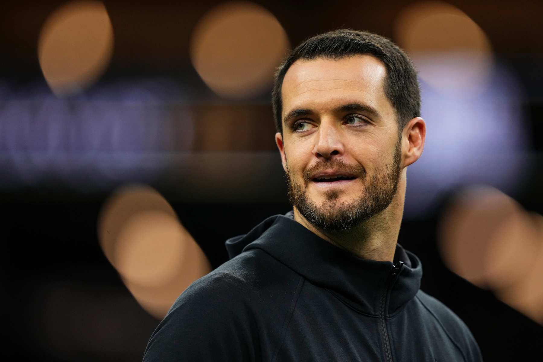 NEW ORLEANS, LA - DECEMBER 29: Derek Carr #4 of the New Orleans Saints looks on from the field during warmups prior to an NFL football game against the Las Vegas Raiders at Caesars Superdome on December 29, 2024 in New Orleans, Louisiana. (Photo by Cooper Neill/Getty Images)