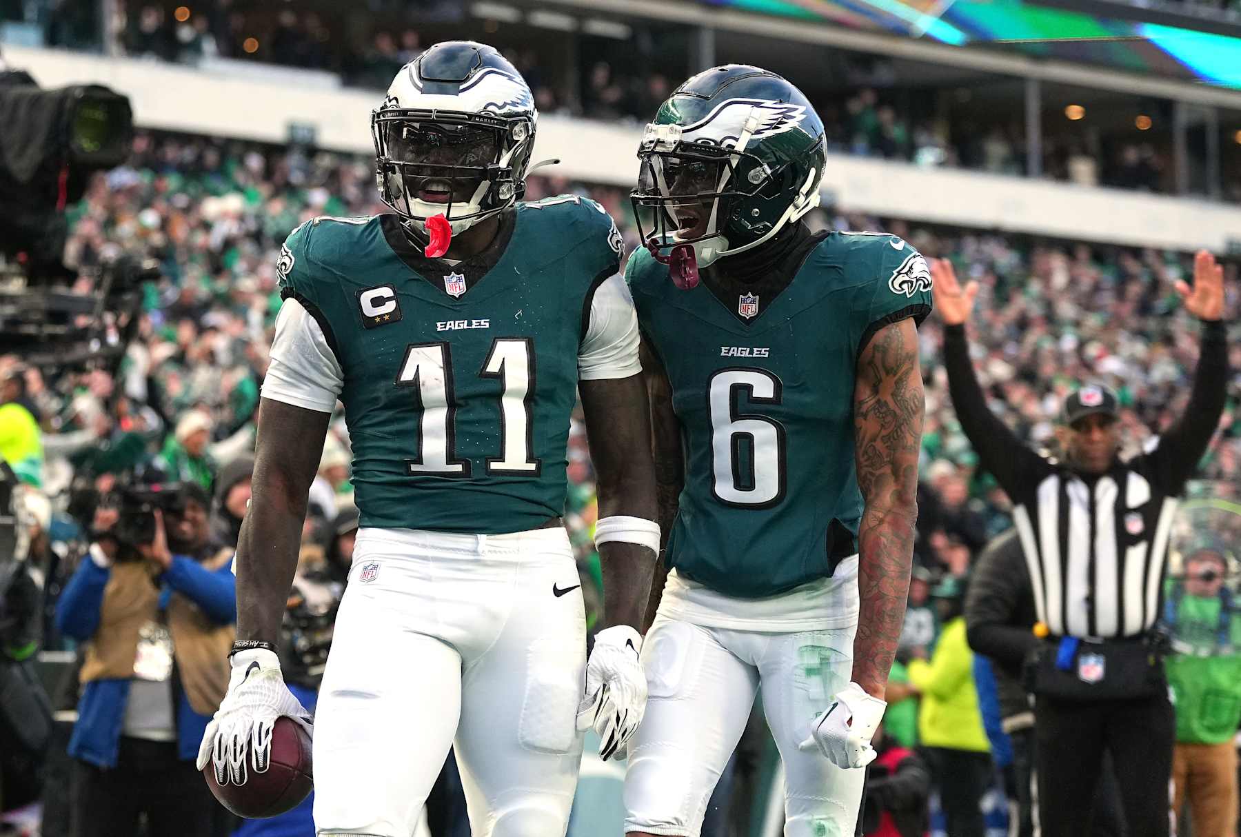 PHILADELPHIA, PENNSYLVANIA - JANUARY 26: A.J. Brown #11 of the Philadelphia Eagles celebrates his touchdown catch with teammate DeVonta Smith #6 while playing against the Washington Commanders during the second quarter in the NFC Championship Game at Lincoln Financial Field on January 26, 2025 in Philadelphia, Pennsylvania. (Photo by Mitchell Leff/Getty Images)