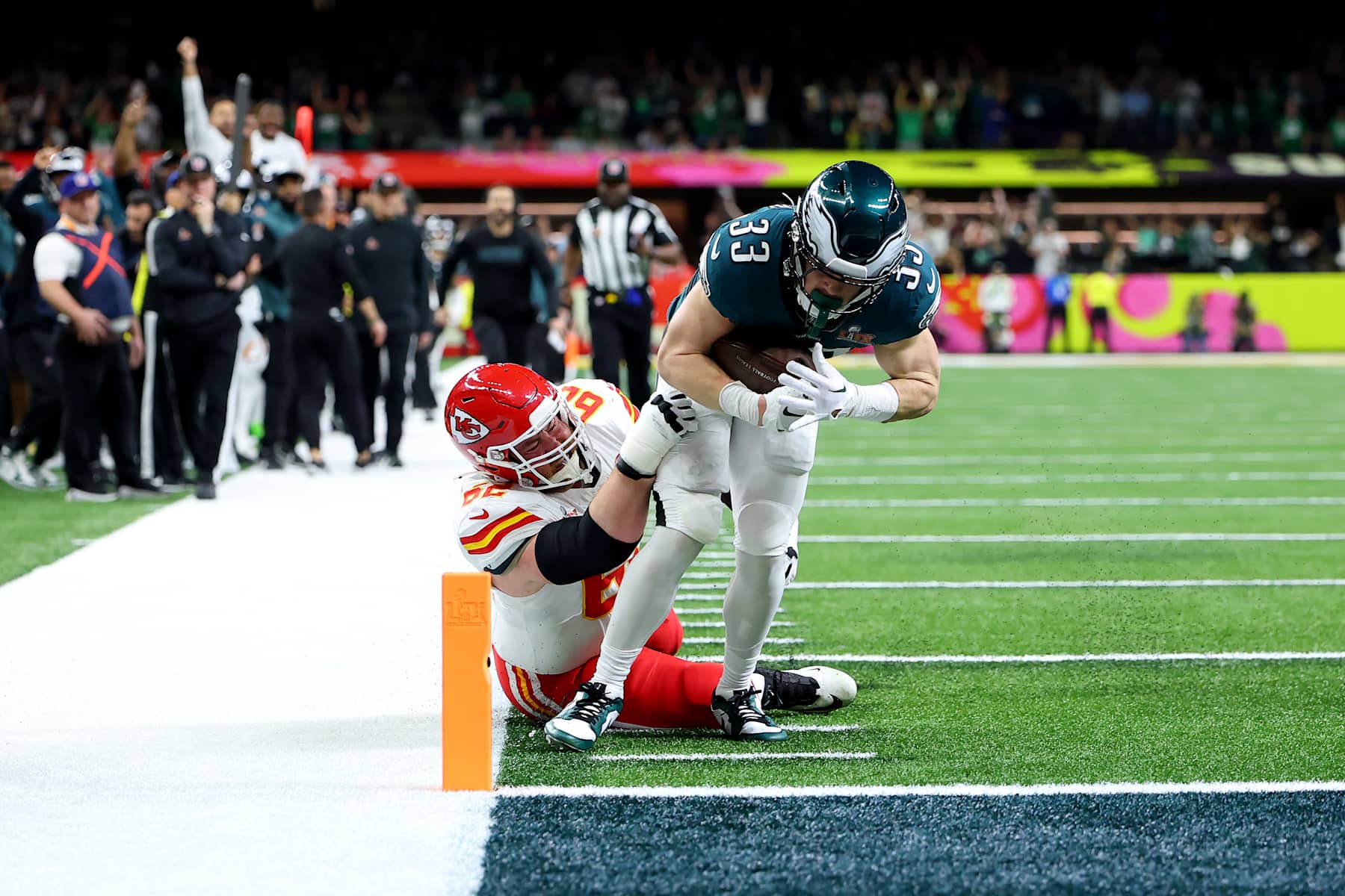NEW ORLEANS, LOUISIANA - FEBRUARY 09: Cooper DeJean #33 of the Philadelphia Eagles scores a touchdown past Joe Thuney #62 of the Kansas City Chiefs after making an interception in the second quarter during Super Bowl LIX at Caesars Superdome on February 09, 2025 in New Orleans, Louisiana. (Photo by Gregory Shamus/Getty Images)