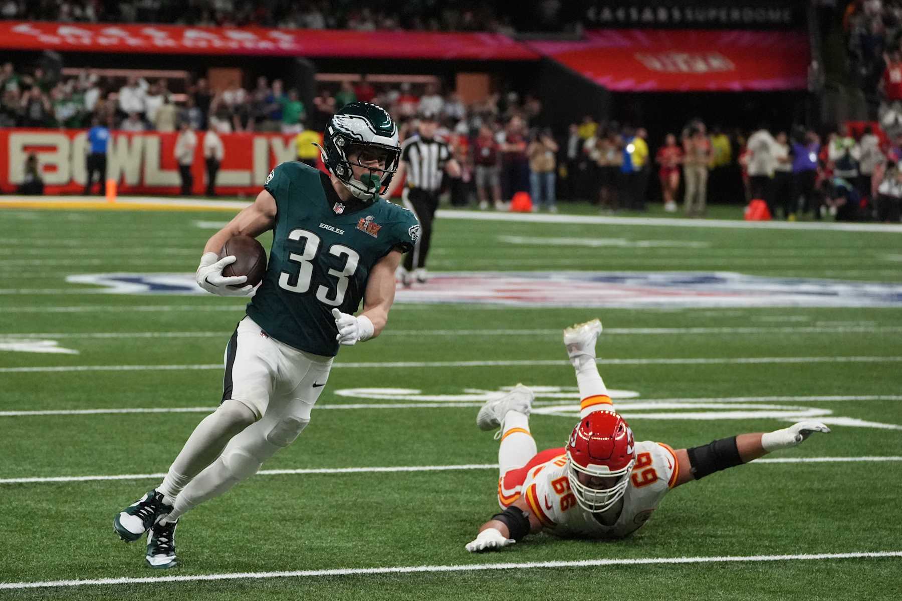 TOPSHOT - Philadelphia Eagles' defensive back #33 Cooper DeJean returns an interception for a touchdown during Super Bowl LIX between the Kansas City Chiefs and the Philadelphia Eagles at Caesars Superdome in New Orleans, Louisiana, February 9, 2025. (Photo by TIMOTHY A. CLARY / AFP) (Photo by TIMOTHY A. CLARY/AFP via Getty Images)          