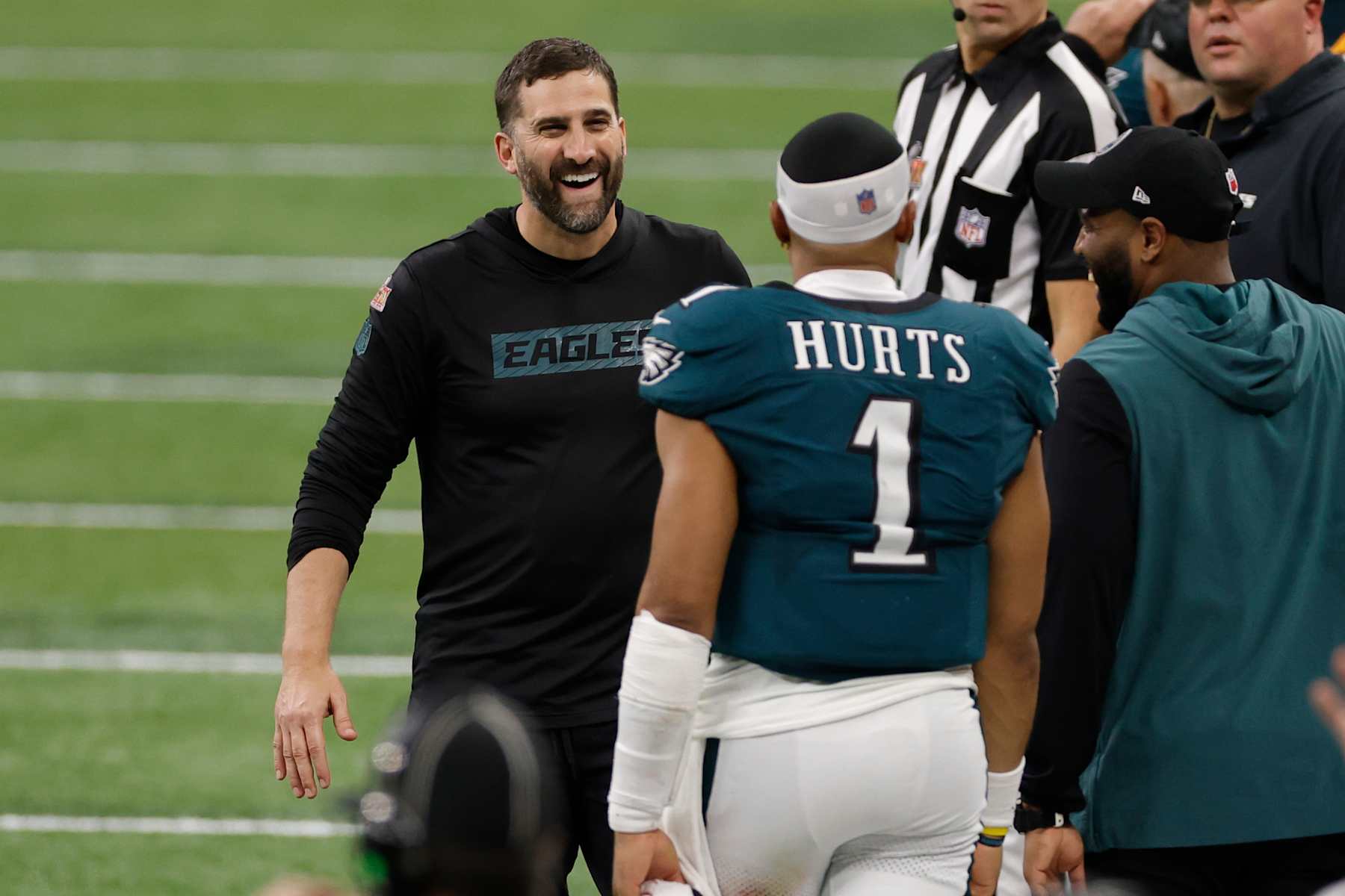 NEW ORLEANS, LA - FEBRUARY 09: Head Coach Nick Sirianni of the Philadelphia Eagles smiles at QB Jalen Hurts #1 of the Philadelphia Eagles in the fourth quarter during Super Bowl LIX between the Philadelphia Eagles and the Kansas City Chiefs on February 09, 2025, at the Caesars Superdome in New Orleans, LA.  (Photo by Bob Kupbens/Icon Sportswire via Getty Images)