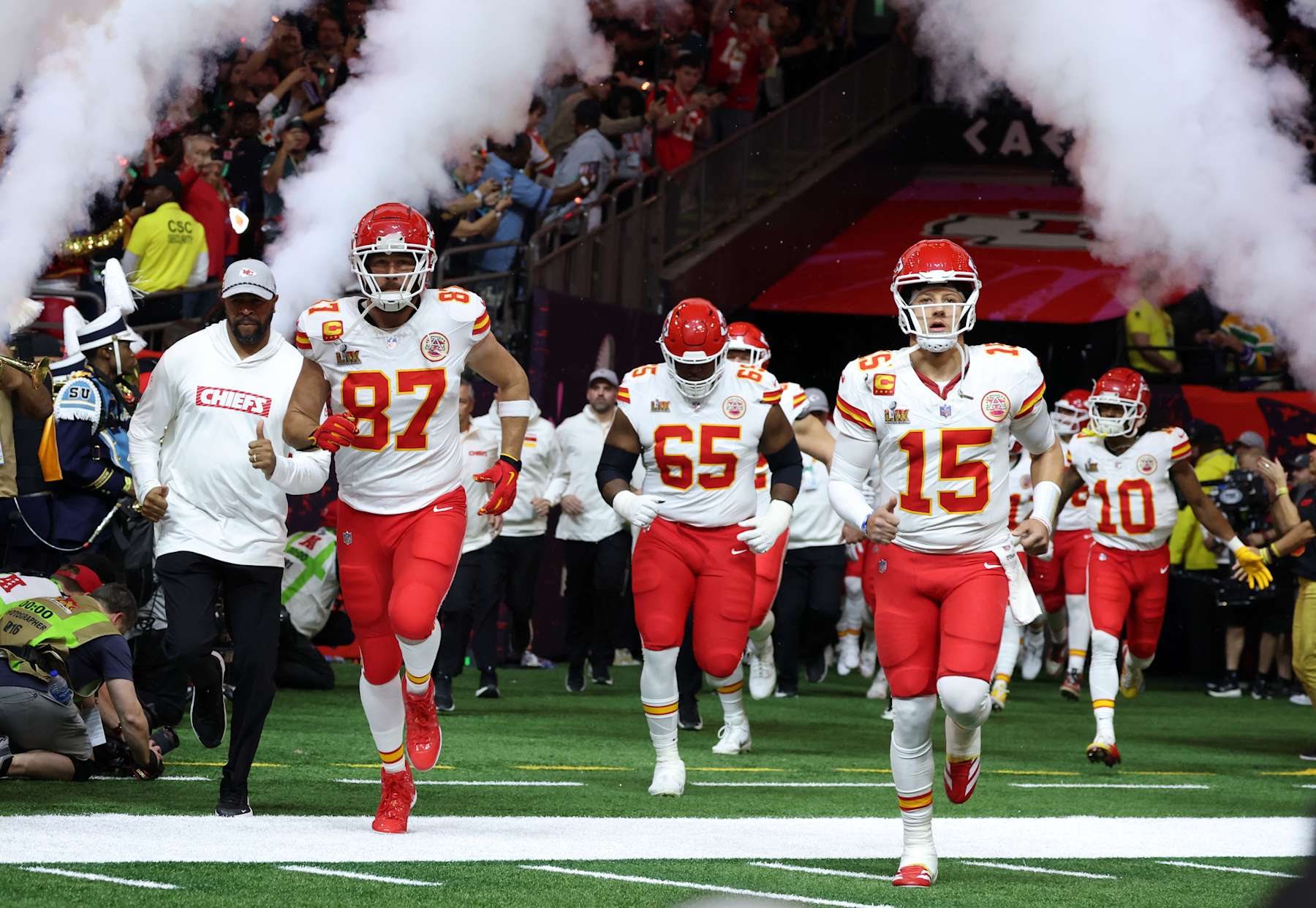 NEW ORLEANS, LOUISIANA - FEBRUARY 09: Travis Kelce, Trey Smith, Patrick Mahomes, Isiah Pacheco, and the Kansas City Chiefs team enter the field during the Super Bowl LIX Pregame at Caesars Superdome on February 09, 2025 in New Orleans, Louisiana.  (Photo by Kevin Mazur/Getty Images for Roc Nation)