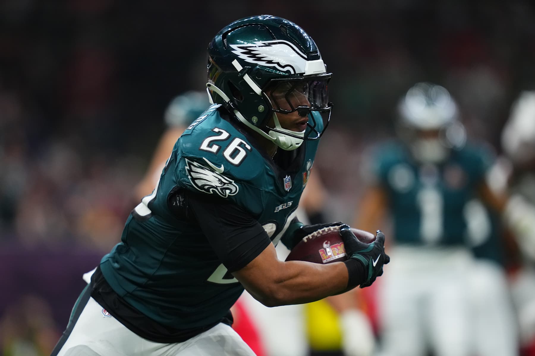 NEW ORLEANS, LA - FEBRUARY 09: Saquon Barkley #26 of the Philadelphia Eagles runs with the ball against the Kansas City Chiefs during Super Bowl LIX at Caesars Superdome on February 9, 2025 in New Orleans, Louisiana. (Photo by Cooper Neill/Getty Images)