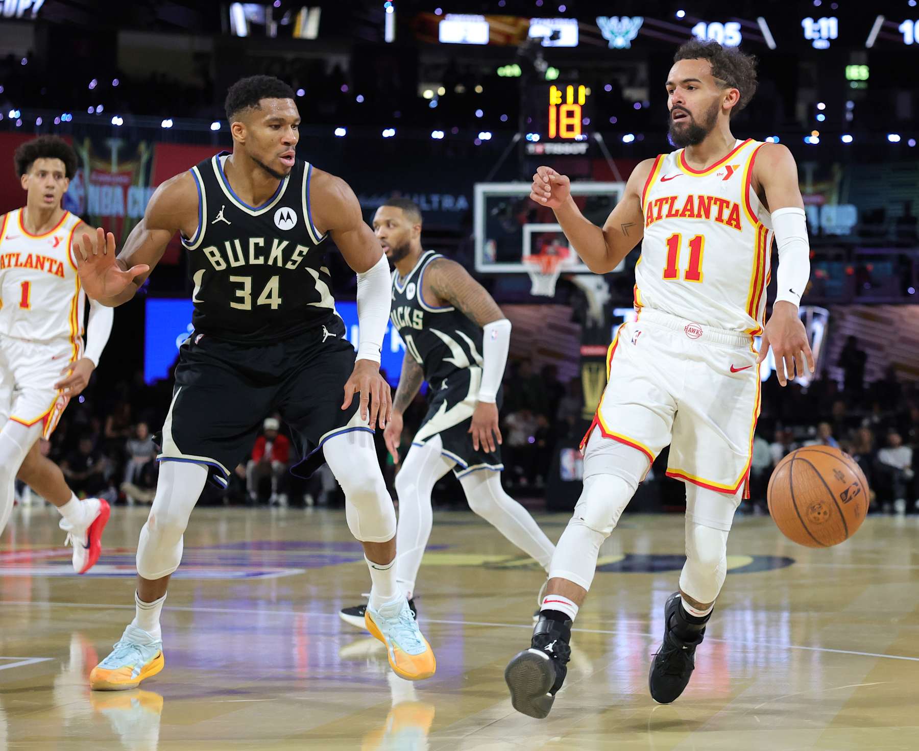 LAS VEGAS, NEVADA - DECEMBER 14: Trae Young #11 of the Atlanta Hawks drives against Giannis Antetokounmpo #34 of the Milwaukee Bucks in the second half of a semifinal game of the Emirates NBA Cup at T-Mobile Arena on December 14, 2024 in Las Vegas, Nevada. The Bucks defeated the Hawks 110-102. NOTE TO USER: User expressly acknowledges and agrees that, by downloading and or using this photograph, User is consenting to the terms and conditions of the Getty Images License Agreement. (Photo by Ethan Miller/Getty Images)