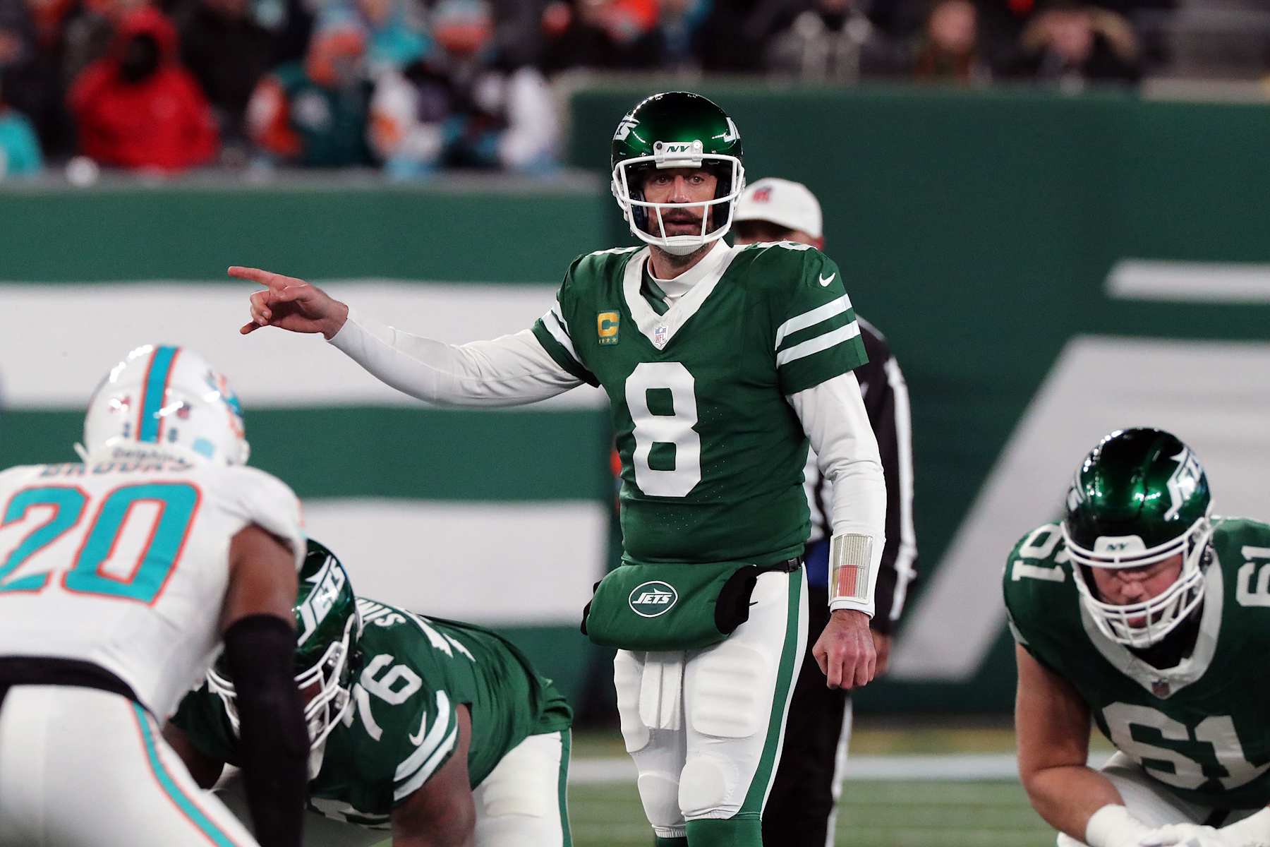 EAST RUTHERFORD, NEW JERSEY - JANUARY 5: Quarterback Aaron Rodgers #8 of the New York Jets calls a play in the game between the Miami Dolphins against the New York Jets at MetLife Stadium on January 5, 2025 in East Rutherford, New Jersey. (Photo by Al Pereira/Getty Images)