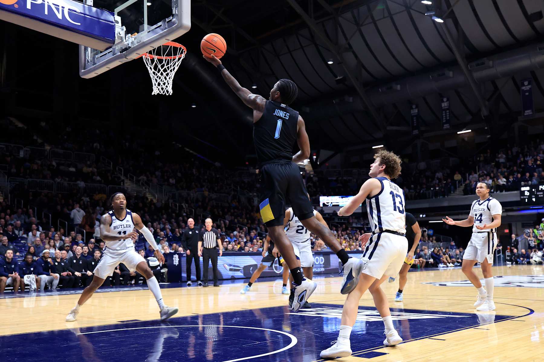 INDIANAPOLIS, INDIANA - JANUARY 28: Kam Jones #1 of the Marquette Golden Eagles takes a shot over Finley Bizjack #13 of the Butler Bulldogs during the first half at Hinkle Fieldhouse on January 28, 2025 in Indianapolis, Indiana. (Photo by Justin Casterline/Getty Images)
