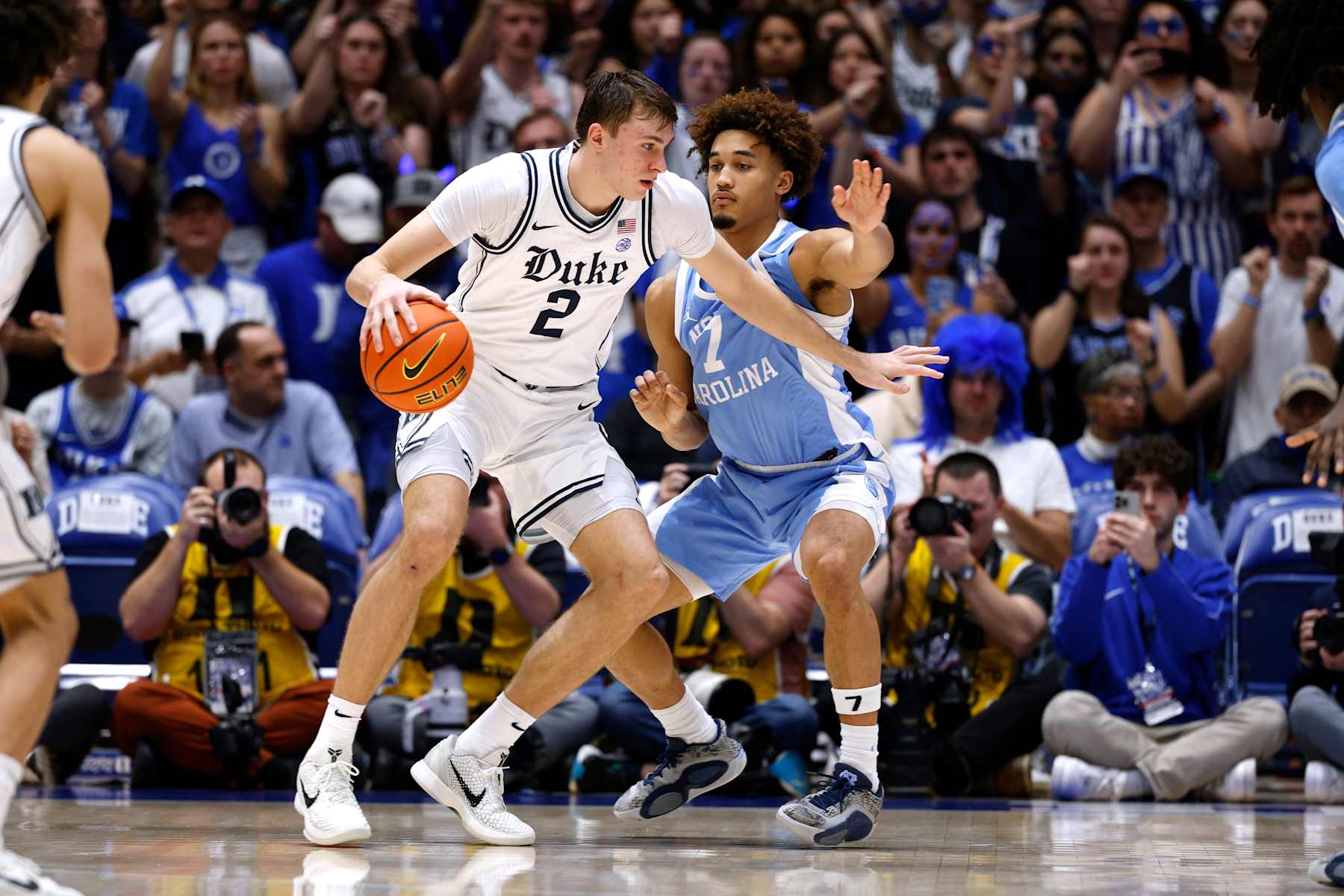 DURHAM, NORTH CAROLINA - FEBRUARY 01: Cooper Flagg #2 of the Duke Blue Devils moves the ball against Seth Trimble #7 of the North Carolina Tar Heels during the second half at Cameron Indoor Stadium on February 1, 2025 in Durham, North Carolina. (Photo by Lance King/Getty Images)