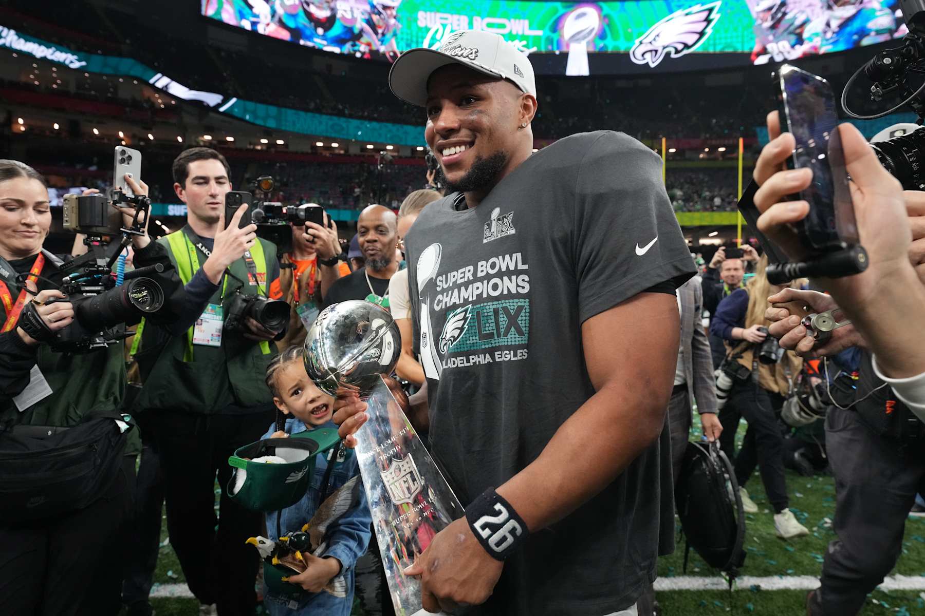 Football: Super Bowl LIX: Philadelphia Eagles Saquon Barkley (26) in action, victorious with the Vince Lombardi trophy vs Kansas City Chiefs at Caesar's Superdome.
New Orleans, LA 2/9/2025
CREDIT: Erick W. Rasco (Photo by Erick W. Rasco/Sports Illustrated via Getty Images)
(Set Number: X164676 TK1)