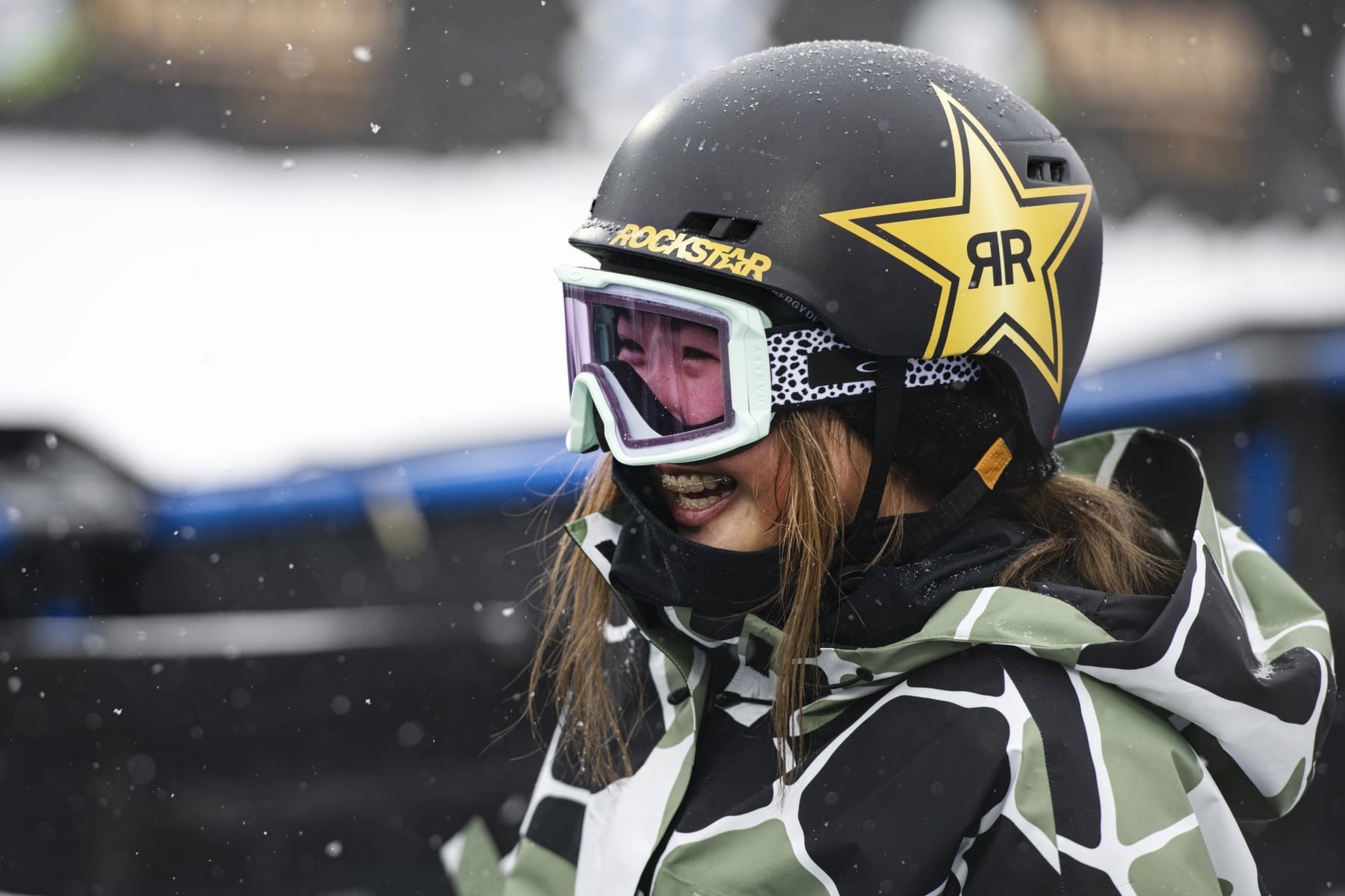 Japanese snowboarder Reira Iwabuchi laughs with teammates at the bottom of the big air jump during practice at X Games Aspen in Aspen, Colo., Friday, Jan. 27, 2023. (AP Photo/Kelsey Brunner)