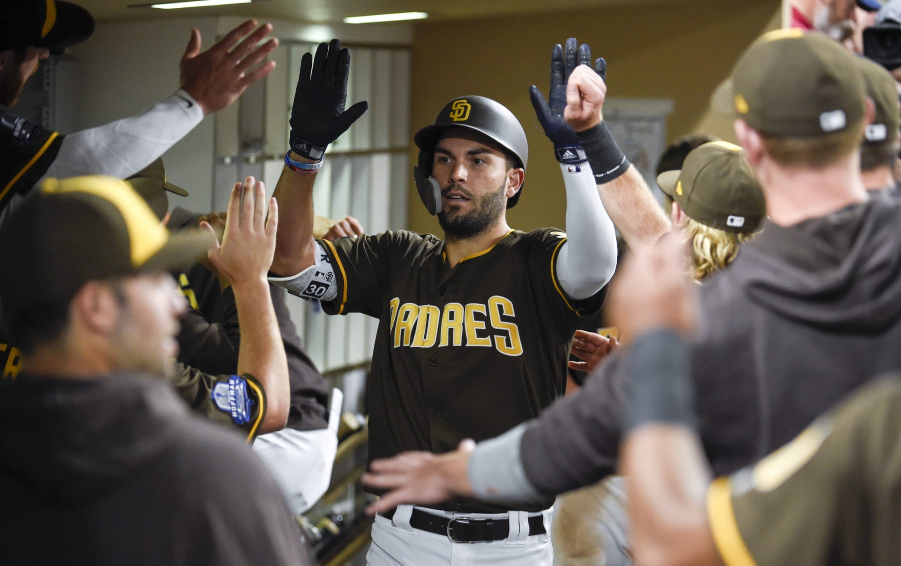 SAN DIEGO, CA - AUGUST 17: Eric Hosmer #30 of the San Diego Padres is congratulated after hitting a solo home run during the fifth inning of a baseball game against the Arizona Diamondbacks at PETCO Park on August 17, 2018 in San Diego, California. (Photo by Denis Poroy/Getty Images)