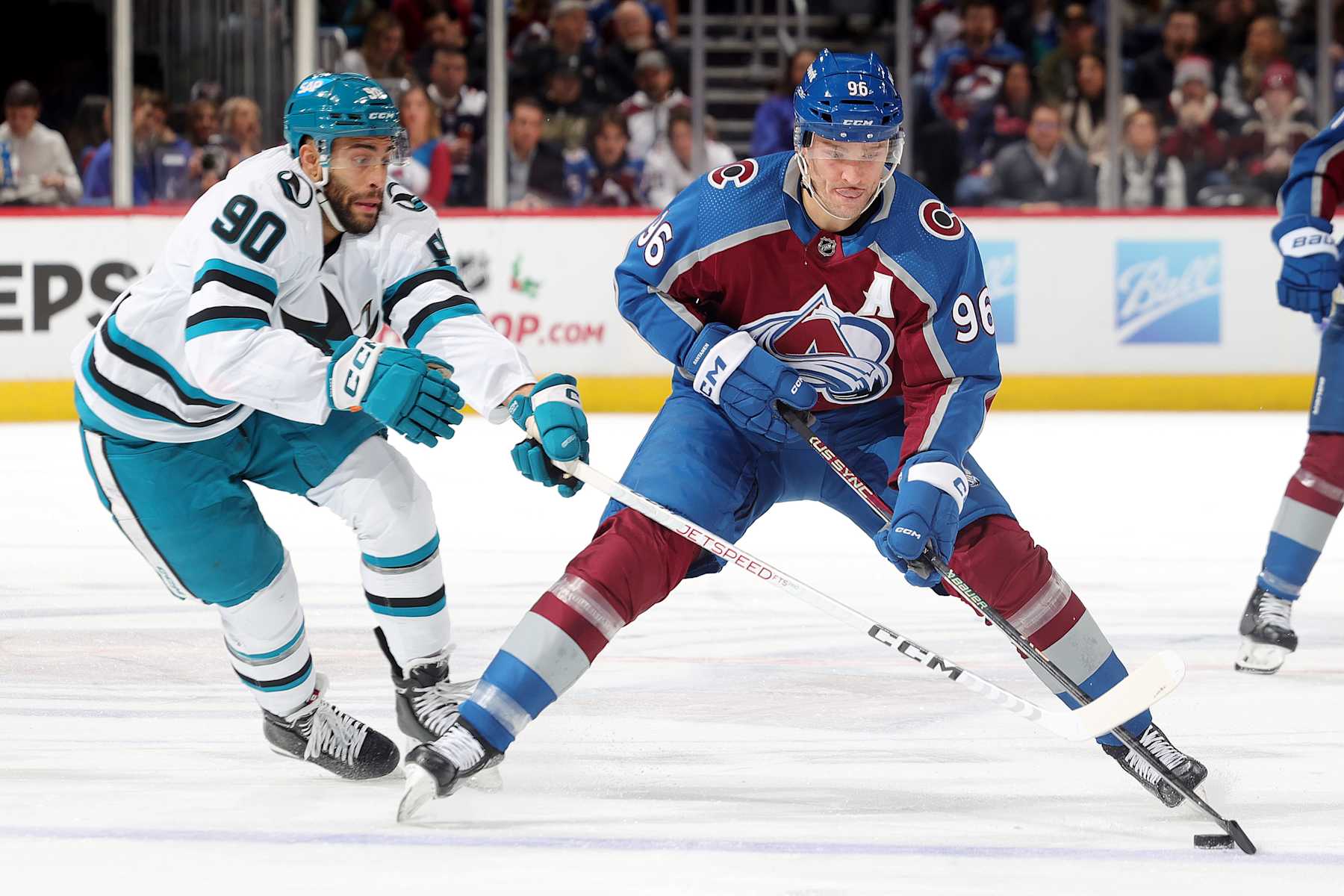 DENVER, COLORADO - DECEMBER 17: Mikko Rantanen #96 of the Colorado Avalanche skates against Justin Bailey #90 of the San Jose Sharks at Ball Arena on December 17, 2023 in Denver, Colorado. (Photo by Michael Martin/NHLI via Getty Images)