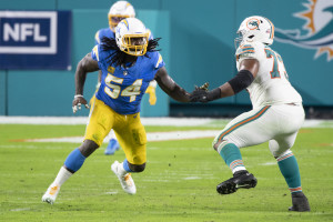 What are financial implications of Dolphins' trade for Isaiah Wilson?