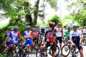 Tour De France Cyclists Stage Protest for Safer Conditions After Fan Caused Crash