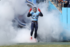 INGLEWOOD, CA - NOVEMBER 7: Tennessee Titans running back Adrian Peterson  #8 father Nelson Peterson holds up his son game worn jersey after the  Tennessee Titans game versus the Los Angeles Rams