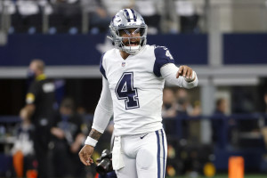 Why are Dallas Cowboys wearing red stripe on helmet vs. Broncos?