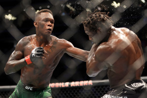 Israel Adesanya Beats Jared Cannonier via Decision to Retain Title at UFC 276