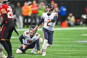 Chicago, United States. 24th Dec, 2022. Chicago Bears quarterback Justin  Fields (1) autographs jerseies for some fans at Soldier Field in Chicago on Saturday,  December 24, 2022. The Bills won 35-13. Photo