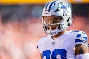 Arlington, United States. 24th Dec, 2022. Dallas Cowboys Dak Prescott gets  stopped by and Philadelphia Eagles T.J. Edwards during their NFL game at  AT&T Stadium in Arlington, Texas on Saturday, December 24