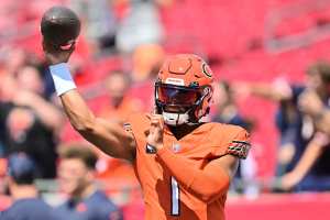 Chicago Bears quarterback Justin Fields halts his momentum before