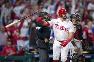 Phillies' Bryce Harper OK after collision at first base: 'He just hit my  funny bone