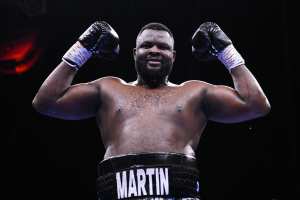 Boxer Martin Bakole Stung Multiple Times After Swallowing Wasp vs. Carlos Takam
