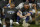 FILE - Los Angeles Dodgers manager Dave Roberts, left, and third baseman Justin Turner pose for a group picture after the Dodgers defeated the Tampa Bay Rays 3-1 in Game 6 to win the baseball World Series in Arlington, Texas, in this Tuesday, Oct. 27, 2020, file photo. Justin Turner's extended flirtation with free agency ended where it began â€” with the Los Angeles Dodgers. Along the way, the third baseman had doubts about whether he would return to his hometown team and wondered if his mask-less appearance on the field to celebrate its World Series championship would hurt him. (AP Photo/Eric Gay, File)