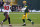 GREEN BAY, WISCONSIN - JANUARY 24: Aaron Rodgers #12 of the Green Bay Packers is pursued by Jason Pierre-Paul #90 of the Tampa Bay Buccaneers during the NFC Championship game at Lambeau Field on January 24, 2021 in Green Bay, Wisconsin. The Buccaneers defeated the Packers 31-26.  (Photo by Stacy Revere/Getty Images)