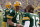 GREEN BAY, WI - NOVEMBER 11: Brett Favre #4 of the Green Bay Packers talks with  Aaron Rodgers #12 during the game against the Minnesota Vikings give chase on November 11, 2007 at Lambeau Field in Green Bay, Wisconsin. (Photo by Jonathan Daniel/Getty Images)