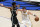 Brooklyn Nets' Kyrie Irving (11) defends as Dallas Mavericks guard Luka Doncic (77) advances the ball upcourt in the first half of an NBA basketball game in Dallas, Thursday, May 6, 2021. (AP Photo/Tony Gutierrez)