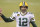 Green Bay Packers quarterback Aaron Rodgers (12) in action during the first half of an NFL football game against the Chicago Bears, Sunday, Jan. 3, 2021, in Chicago. (AP Photo/Kamil Krzaczynski)