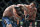 ARCHIVO - En imagen de archivo del 8 de junio de 2019, Tony Ferguson, derecha, falla un golpe lanzado a Donald Cerrone, izquierda, durante su combate en el evento UFC 238 en Chicago. (AP Foto/Kamil Krzaczynski, archivo)
