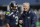 Seattle Seahawks quarterback Russell Wilson, left, talks with head coach Pete Carroll, right, before an NFL football game against the Atlanta Falcons, Sunday, Oct. 16, 2016, in Seattle. (AP Photo/Elaine Thompson)