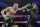 FILE - In this Feb. 22, 2020, file photo, Tyson Fury, left, of England, fights Deontay Wilder during a WBC heavyweight championship boxing match in Las Vegas. An all-British world heavyweight title showdown between Anthony Joshua and Tyson Fury in 2021 is a step closer. Fury said Wednesday, June 10, 2020, that an agreement has been reached with Joshua's camp on a two-fight deal between the current holders of the heavyweight belts.(AP Photo/Isaac Brekken, File)