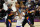 Los Angeles Lakers guard Alex Caruso (4) drives past Phoenix Suns forward Cameron Johnson, left, guard Cameron Payne, second from right, and center Deandre Ayton (22) during the first half of Game 1 of their NBA basketball first-round playoff series Sunday, May 23, 2021, in Phoenix. (AP Photo/Ross D. Franklin)