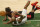 Miami Heat forward Jimmy Butler (22) falls to the floor against the Milwaukee Bucks during the first half of Game 2 of an NBA basketball first-round playoff series Monday, May 24, 2021, in Milwaukee. (AP Photo/Jeffrey Phelps)