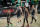 Brooklyn Nets guard Kyrie Irving (11), Joe Harris (12), forward Kevin Durant and guard Landry Shamet (20) walk to the bench during the second half of Game 1 of an NBA basketball first-round playoff series against the Boston Celtics Saturday, May 22, 2021, in New York. (AP Photo/Corey Sipkin)