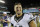 FILE - In this Aug. 22, 2015, file photo, Philadelphia Eagles' Tim Tebow walks off the field after a preseason NFL football game against the Baltimore Ravens in Philadelphia. Tebow and coach Urban Meyer are together again, this time in the NFL and with Tebow playing a new position. The former Florida star and 2007 Heisman Trophy-winning quarterback signed a one-year contract with the Jacksonville Jaguars on Thursday, May 20, 2021, and will attempt to revive his pro career as a tight end. (AP Photo/Michael Perez, File)