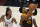 Utah Jazz guard Donovan Mitchell (45) goes to the basket as Memphis Grizzlies guard Ja Morant (12) watches during the second half of Game 2 of their NBA basketball first-round playoff series Wednesday, May 26, 2021, in Salt Lake City. (AP Photo/Rick Bowmer)