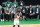 Fans watch as Brooklyn Nets guard Kyrie Irving handles the ball in the second quarter of Game 3 against the Boston Celtics during an NBA basketball first-round playoff series, Friday, May 28, 2021, in Boston. Irving, an ex-Celtic, was repeatedly booed by the TD Garden fans. (AP Photo/Elise Amendola)