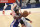 Philadelphia 76ers center Joel Embiid, left, goes to the basket past Washington Wizards center Daniel Gafford, right, during the second half of Game 3 in a first-round NBA basketball playoff series, Saturday, May 29, 2021, in Washington. (AP Photo/Nick Wass)